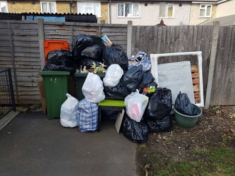 Collection crew in London preparing recyclables at a curbside
