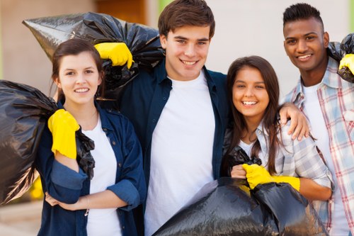 Staff assisting a customer at a waste collection point in London